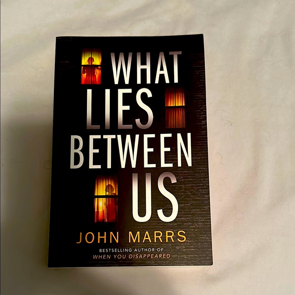 What Lies Between Is by John Marrs